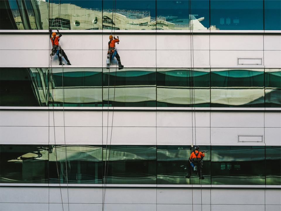 Window washers cleaning glass